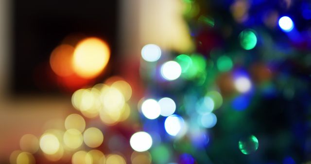Blurred Christmas lights creating a soft, festive bokeh effect with colorful hues. Perfect for holiday greeting cards, background designs, festive promotions, and seasonal social media themes focusing on the warmth and joy of Christmas.
