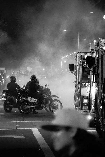 Police Officers on Motorcycles in Smoky Urban Street at Night - Download Free Stock Photos Pikwizard.com