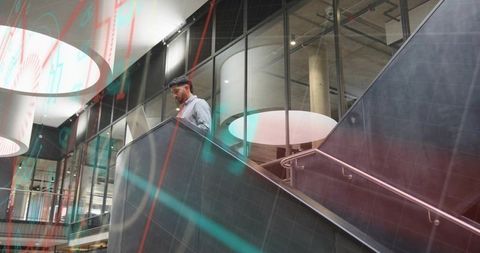 Professional Examining Laptop Data Near Corporate Escalator