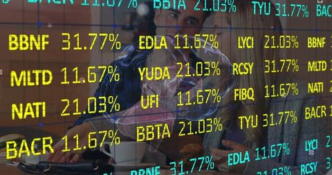 Office professionals analyzing digital displays