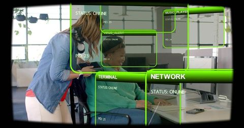 Colleagues collaborating at desk with augmented reality network overlays and monitors