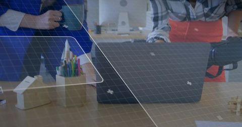 Collaborative Work in Modern Office with Laptops and Technology