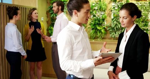 Diverse Business Executives Collaborating in Modern Office Setting