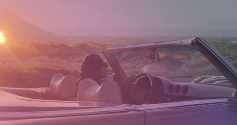 Woman Enjoying Sunset Drive in Convertible on Open Road - Download Free Stock Images Pikwizard.com