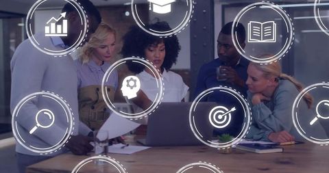 Diverse Team Collaborating Around Laptop with Business Strategy Icons Overlay for Analytics
