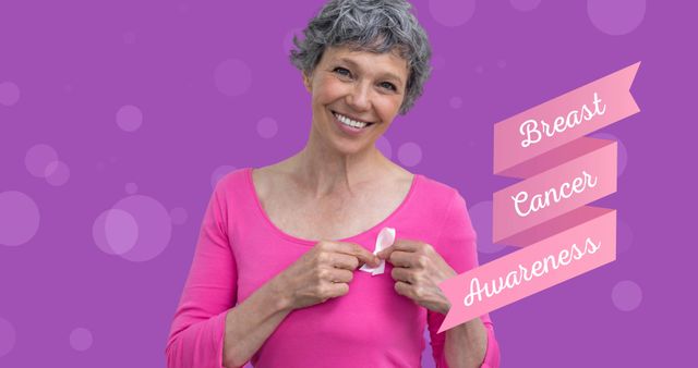 Smiling Elderly Woman Holding Pink Ribbon for Breast Cancer Awareness - Download Free Stock Images Pikwizard.com