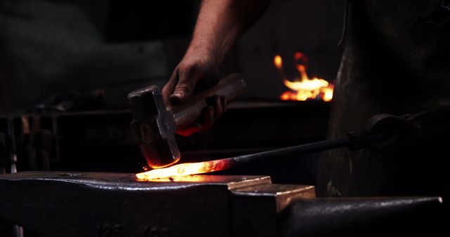 Blacksmith Forging Metal with Hammer and Anvil in Workshop - Download Free Stock Images Pikwizard.com