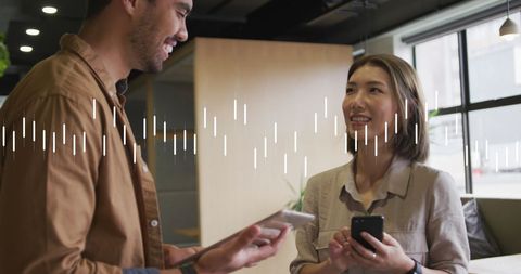 Diverse colleagues engaging in digital data exchange