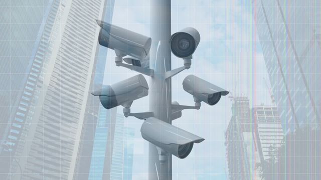 This visual represents a network of surveillance cameras mounted on a pole, set against the backdrop of modern city skyscrapers and a clear blue sky. Ideal for topics related to urban security, technological advancements in public safety, monitoring systems, smart cities, and urban planning. Suitable for use in articles, presentations, or reports focusing on city surveillance systems intended to enhance public safety and security measures.