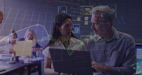 Business Professionals Analyzing Stock Market Data in Modern Office