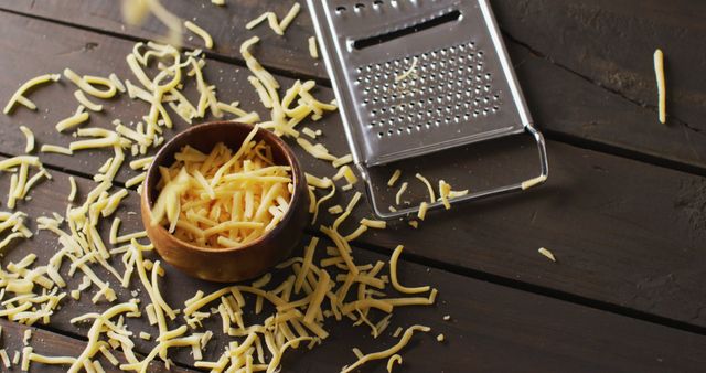 Grated Cheese in Wooden Bowl on Rustic Wooden Table with Cheese Grater - Download Free Stock Images Pikwizard.com