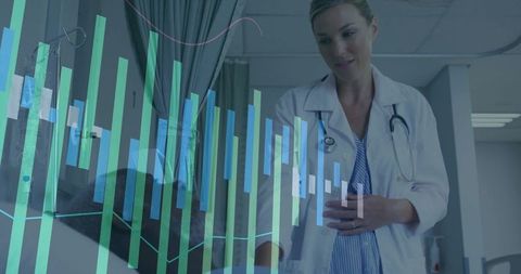 Doctor monitoring patient with health data interface in exam room