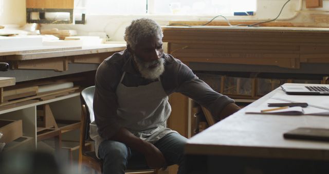 Senior Craftsman in Woodworking Workshop Using Computer - Download Free Stock Images Pikwizard.com