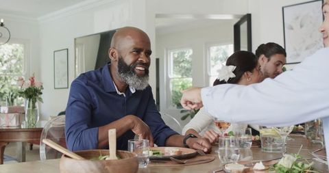 Friends Enjoying Feast at Elegant Wedding Reception