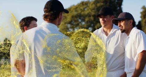 Cricket team sharing pre-match huddle under golden hour glow with energetic yellow overlay
