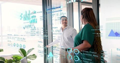 Executives reviewing transparent data projections in office, collaborating with tablet