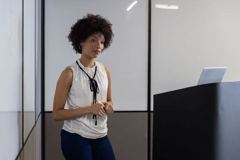 Confident Professional Presenting in Modern Workspace