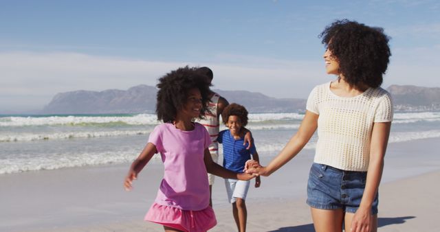 Happy Family Enjoying Sandy Beach Walk Under Bright Sunshine - Download Free Stock Images Pikwizard.com