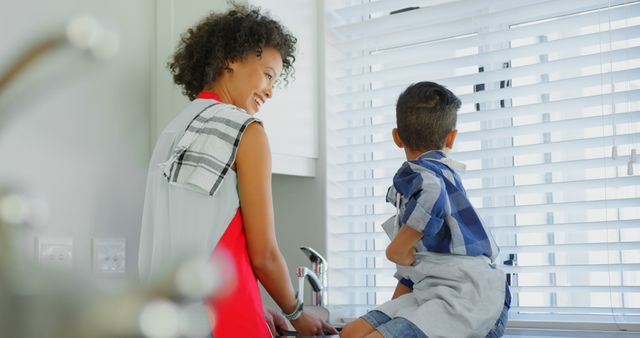 Happy Mother and Son Chatting by Kitchen Window - Download Free Stock Images Pikwizard.com