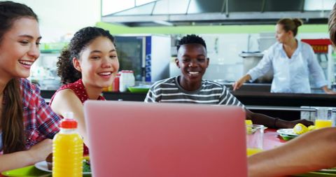 Diverse Teenage Students Collaborating in Cafeteria Setting - Download Free Stock Images Pikwizard.com