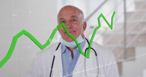 Senior male doctor with data chart overlay in medical corridor
