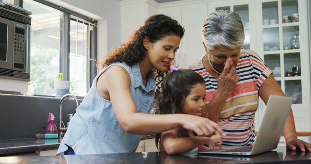 Three Generations of Women Using Laptop in Kitchen at Home - Download Free Stock Images Pikwizard.com