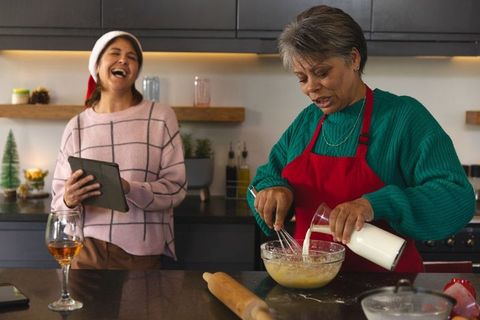 Cheerful Family Cooking Together During Holiday Season