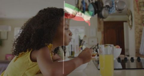Young Girl Enjoying Breakfast with Fresh Juice at Home Counter