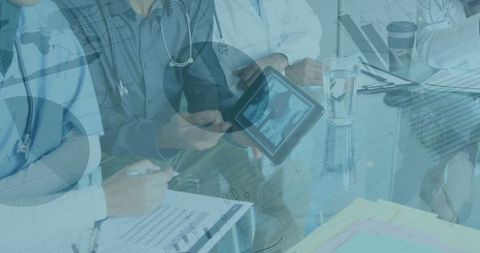 Healthcare Professionals Analyzing Financial Data with Technology