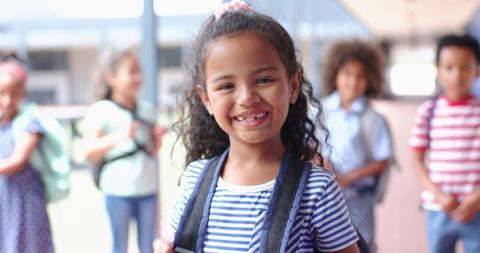 Cheerful Schoolgirl with Backpack Surrounded by Diverse Classmates - Download Free Stock Images Pikwizard.com