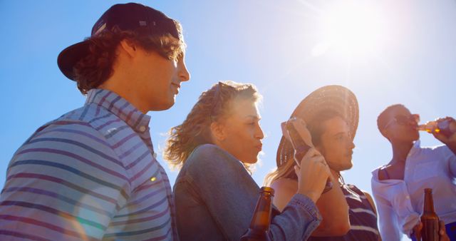 Joyful Diverse Friends Enjoying Beers on Sunny Day - Download Free Stock Images Pikwizard.com