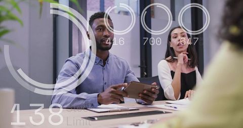 Business Team Leading Strategy Meeting with Tablet and Data Overlays in Modern Office