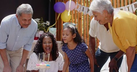 Multigenerational Family Celebrating Birthday Together Outdoors