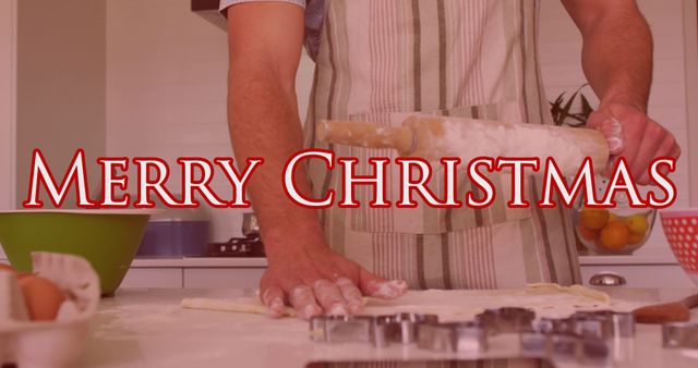 Image of merry christmas text over caucasian man baking. Christmas, celebration and digital interface concept digitally generated image.