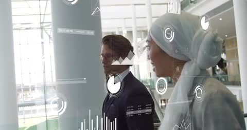 Business Associates Collaborating Amidst Digital Data Charts