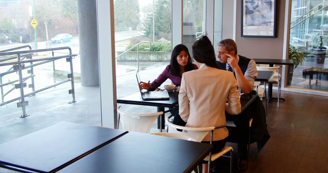 Business Team Holding Meeting in Modern Cafe - Download Free Stock Images Pikwizard.com