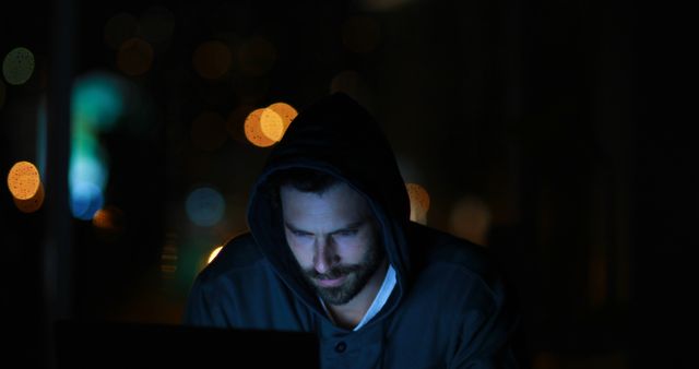 Focused Hacker Working on Laptop with Dark Background - Download Free Stock Images Pikwizard.com