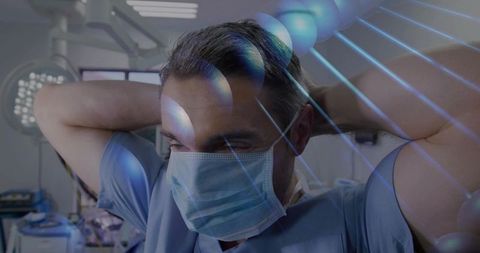 Surgeon tying surgical mask in modern operating room with dna strand overlay