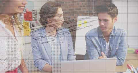 Business Team Analyzing over Data Visualizations in Office