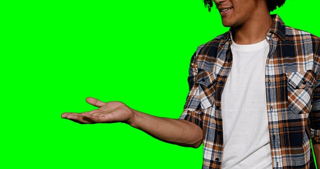 Man pretending to hold screen against green screen