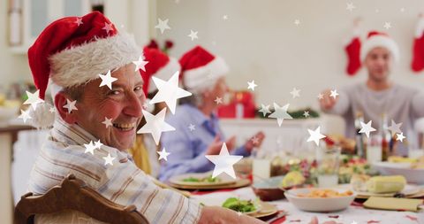 Happy Family Celebrating Christmas With Santa Hats and Festive Meal