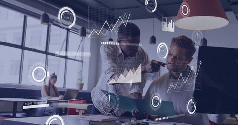 Colleagues collaborating over interactive data visualizations in modern office