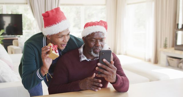 Happy Family Celebrating Christmas with Gifts and Video Call - Download Free Stock Images Pikwizard.com