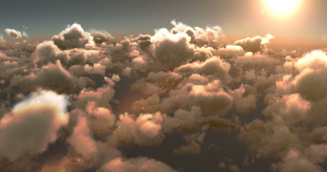 A serene view of fluffy clouds bathed in the warm glow of a setting or rising sun, with copy space. The image conveys a sense of tranquility and the vastness of the sky.