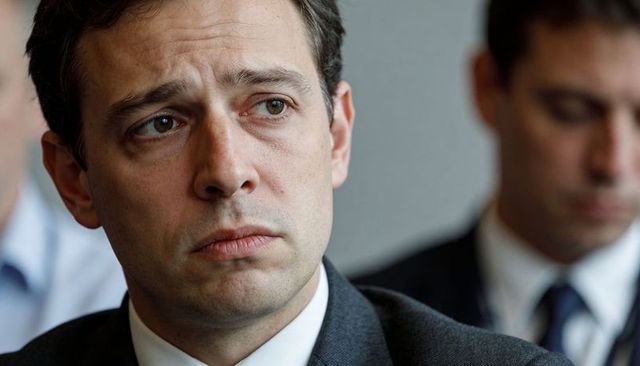 Executive listening intently during boardroom meeting close-up portrait thoughtful leader