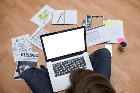 transparent view of man using laptop surrounded by work documents - Download Free Stock Videos Pikwizard.com
