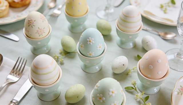 Displaying pastel easter eggs in mint egg cups for spring table decor and centerpiece