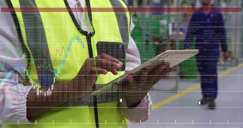Warehouse Inspector using Tablet displaying Data Overlay for Industrial Analytics and Logistics