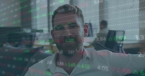 Businessman Analyzing Stock Market Data in Office Setting