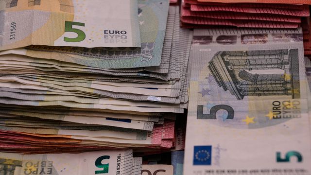 Close-up photograph of neatly stacked euro banknotes showcasing various denominations. This visual is perfect for illustrating concepts related to finance, currency, banking, wealth, and economic discussions. Ideal for use in financial publications, online articles, and educational materials.